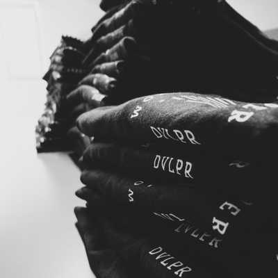 Image of stacked DVLPR shirts